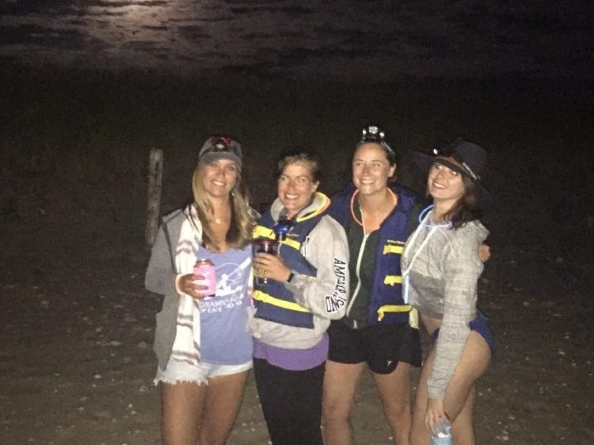A group of women on the Full Moon Adventure Paddleboard Tour with RideAway Adventures