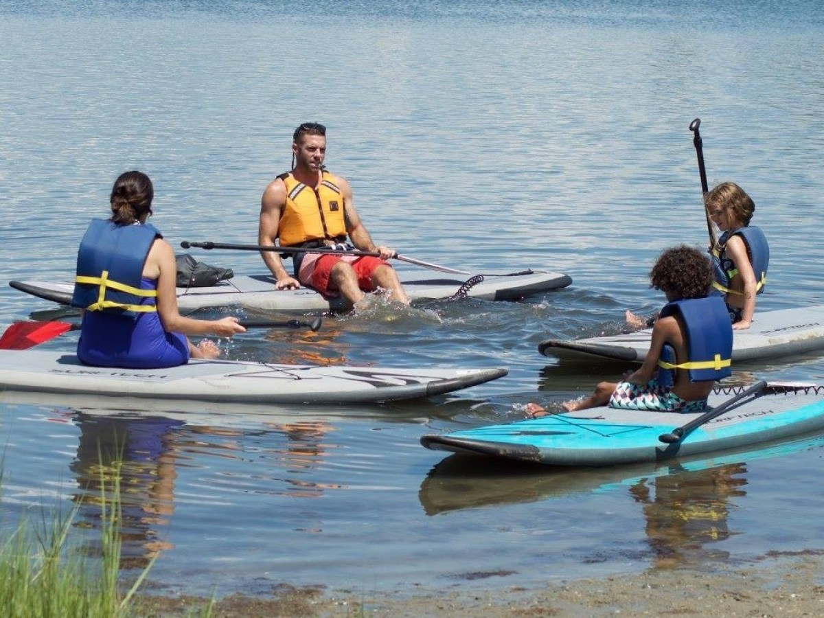 Beginner paddleboard lessons on a pond