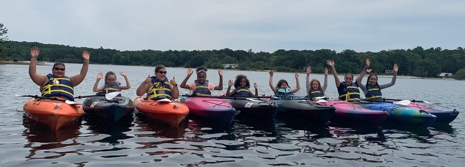 A group of kayakers on Lawrence pond with rentals from RideAway Adventures