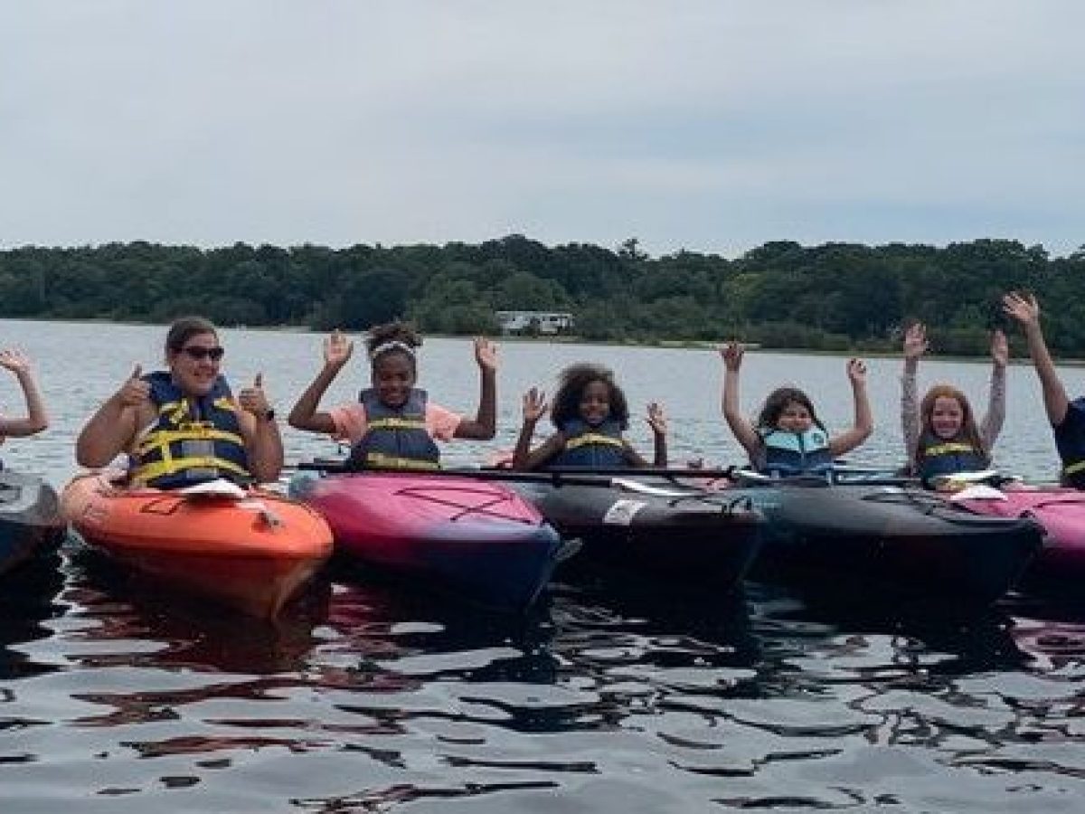 A group of kayakers on Lawrence pond with rentals from RideAway Adventures