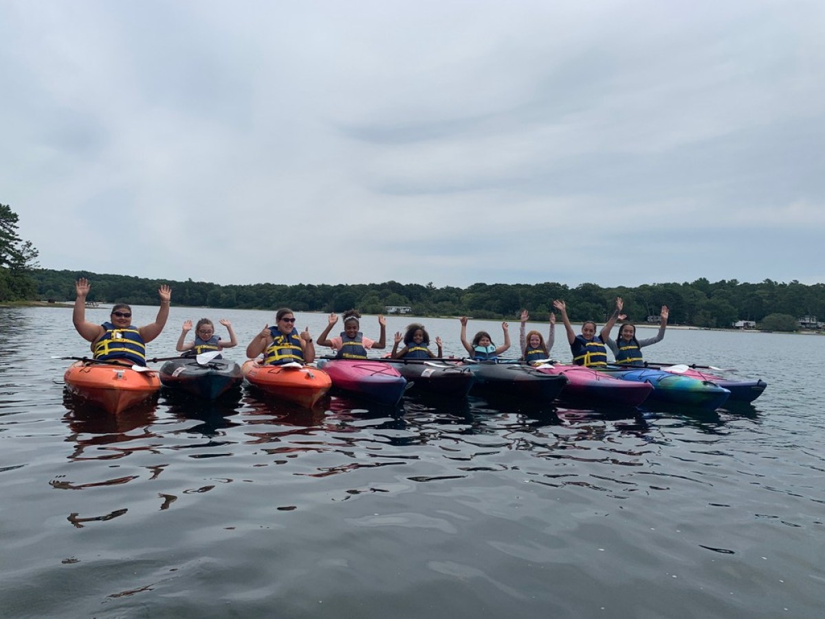 A group of kayakers on Lawrence pond with rentals from RideAway Adventures
