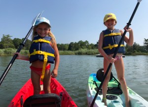 a group of people in a boat on a body of water