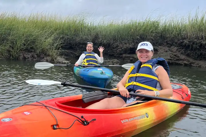 Two locals enjoy their kayak rental with RideAway Adventures during Cape Cod's 