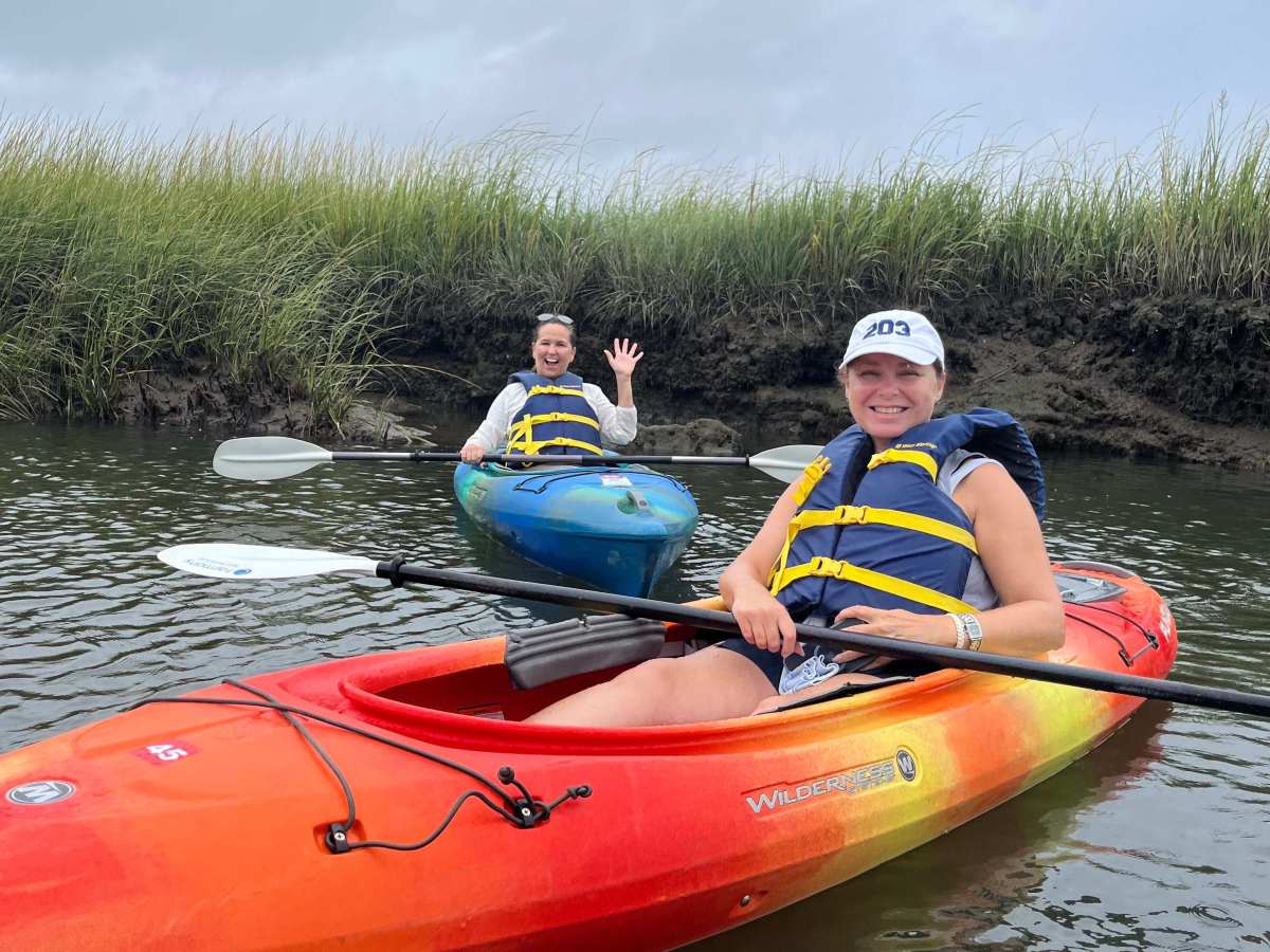 Two locals enjoy their kayak rental with RideAway Adventures during Cape Cod's 