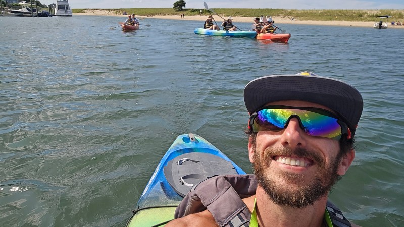 a man in a boat on a body of water